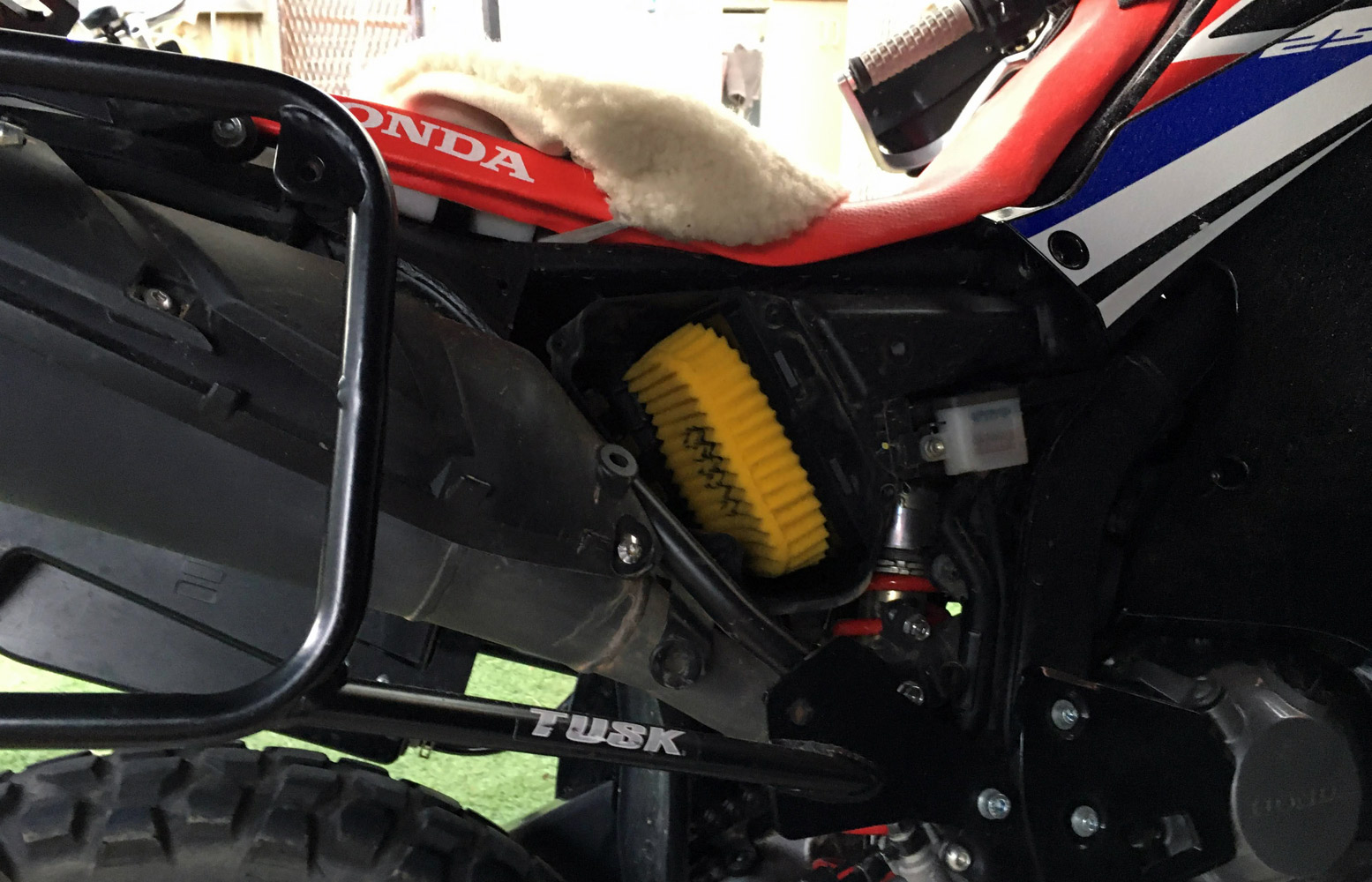 The air filter is accessible by removing the right-hand side middle fairing